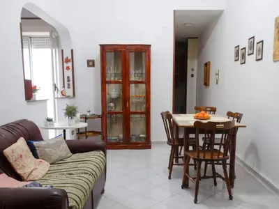 a living room with a couch and a table at Holiday Home Sferracavallo in Palermo
