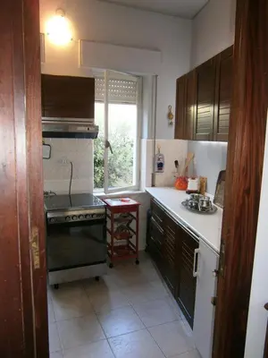 a small kitchen with a stove and a window at Terrazza sul mare in Trabia