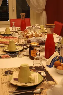 a table topped with plates of food on top at Abatellis Luxury in Palermo