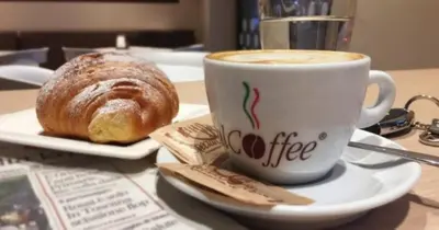 a cup of coffee and a pastry on a table at Casa Vacanze Caccamo Santa Lucia in Caccamo