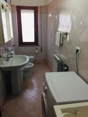 a bathroom with a sink and a toilet at Casa Mia in Altavilla Milicia