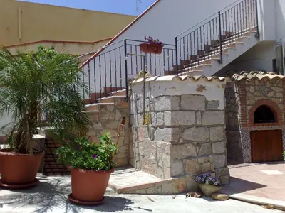 a stone building with a staircase and some plants at VILLA BUTTERFLY 1 sea and history in Capaci