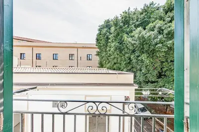 a view of a building from a balcony at GuestHost - Palazzo dei Normanni Stylish Apartment in Palermo