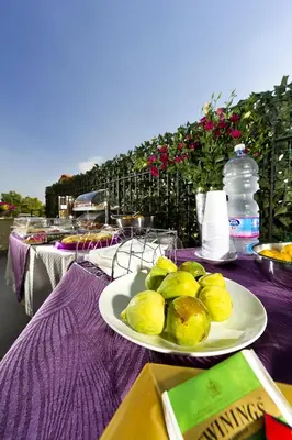 two plates of food sitting on a purple table at Le Camere del Crimiso in Castellammare del Golfo