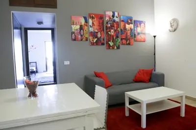 a living room with a couch and a table at Bahlara Case Vacanza in Palermo