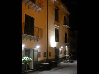 a building at night with a street in front of it at Bahlara Case Vacanza in Palermo