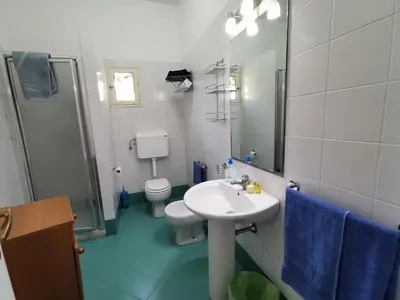 a bathroom with a sink and a toilet and a mirror at Mondello vista in Mondello