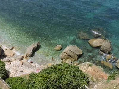 an aerial view of a beach with rocks and water at Aziyz Camere in Castellammare del Golfo