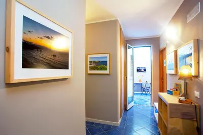 a hallway with a painting on the wall at TerraSole Bakery B&B in Terrasini