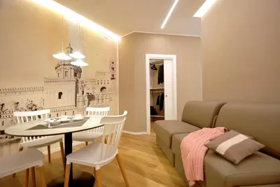 a living room with a table and a couch at BURNÌA Sicily Holiday House in Palermo