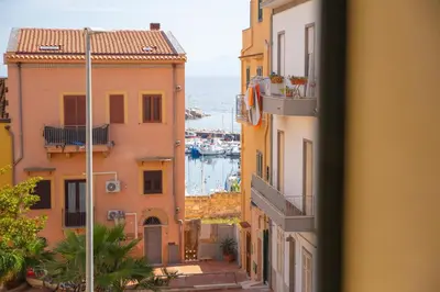 a view of a harbor from a building at Solemar Sicilia - Casa Olivia in Santa Flavia