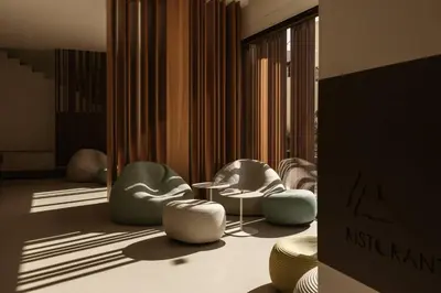 a room with three chairs and a table at Hotel Tannure in San Vito lo Capo