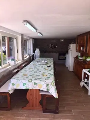a kitchen with a table with a floral table cloth on it at Villa Giulia in Alcamo Marina