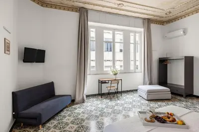 a living room with a couch and a table at Palazzo Amazigh in Palermo