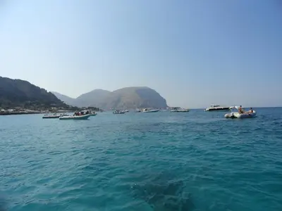 a group of boats floating in the water at Casa Vacanze Laura in Isola delle Femmine