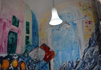 a painting of a room with a light on the wall at B&B Domus Dei Cocchieri in Palermo