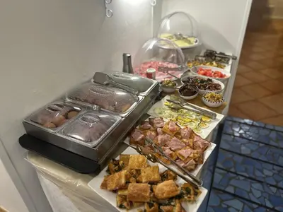 a buffet with many different types of food on a table at Badia Rooms & Breakfast in Castellammare del Golfo