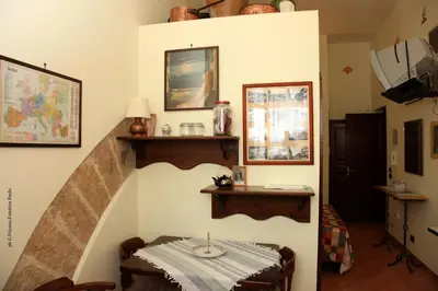 a room with a staircase with a table in it at Donna Lia in Bagheria