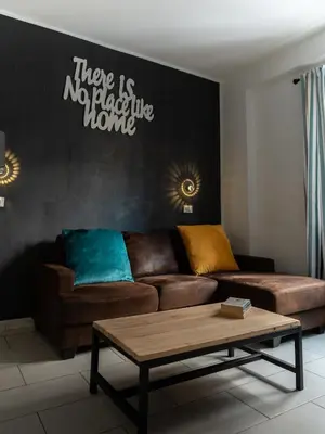 a living room with a couch and a coffee table at Casa in centro in Palermo