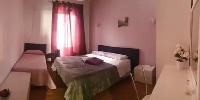 a small room with a bed and a window at Affitta Camere Al Castello in Palermo