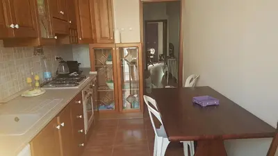 a kitchen with a table and a counter top at Affitta Camere Al Castello in Palermo