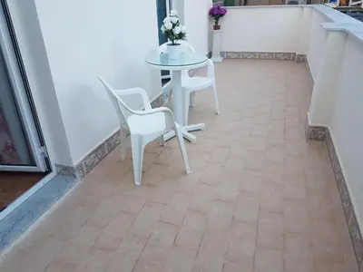 a table and two chairs and a table with a table at Affitta Camere Al Castello in Palermo