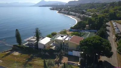 an aerial view of a house next to the water at Villa Francesca 30 Pax by Ville in Palermo in Casteldaccia