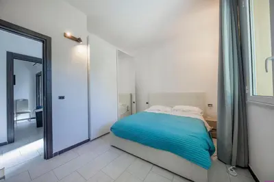 a bedroom with a bed and a large mirror at Villa Francesca 30 Pax by Ville in Palermo in Casteldaccia