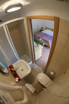 a bathroom with a sink and a mirror at B&B Castiglia in Palermo