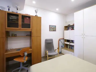 a room with a desk and a table and chairs at Plumeria/Libertà in Palermo