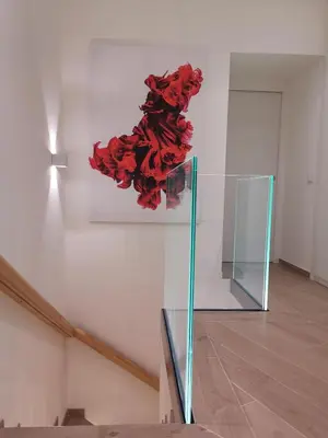 a painting of a red flower on a wall at Betta splendens in Palermo