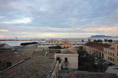a view of a city with buildings and a harbor at Seaview Apartments in Palermo