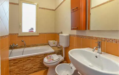 a bathroom with a sink and a toilet and a tub at Beautiful Apartment In Palermo Pa in Sferracavallo