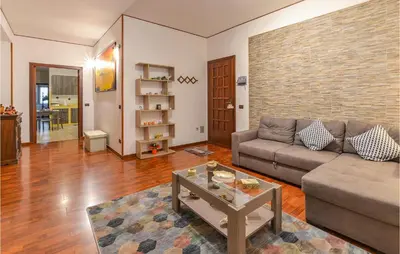 a living room with a couch and a table at Beautiful Apartment In Palermo Pa in Sferracavallo