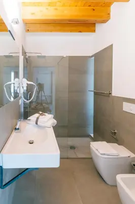 a bathroom with a sink and a toilet at Boutique BnB Dolcevita in Palermo
