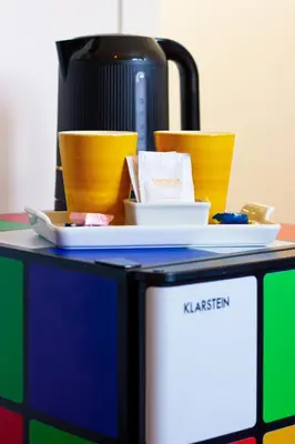 a microwave with bowls and a coffee maker on it at SuperAttico Bella Bellù in Palermo