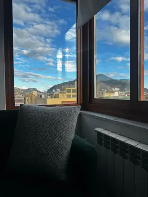 a pillow sitting in front of a window with a view at SuperAttico Bella Bellù in Palermo