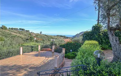 a wooden deck with a view of the ocean at Mages in Casteldaccia