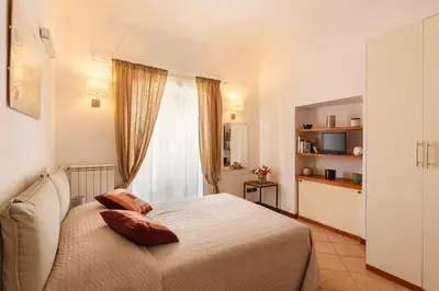 a bedroom with a bed and a window at Palazzo Edy&Stef 1 in Palermo