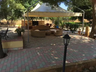 a pavilion with a white canopy on a patio at Hotel Oasi da Paolo in Castelluzzo