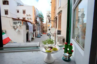 a bowl of food sitting on a window sill at La maison à la cathedral in Palermo