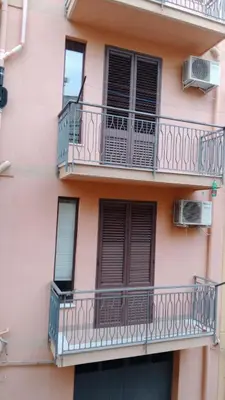 an apartment building with balconies and windows at Casa Casteldaccia 2 in Casteldaccia