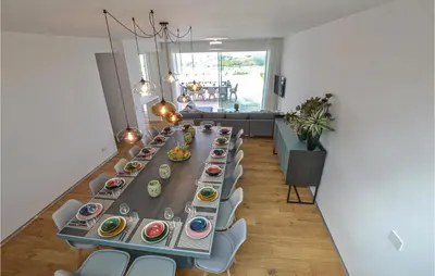 a long long table with plates of food on it at Stunning Home In Balestrate in Balestrate