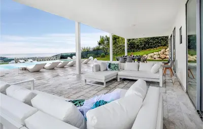 a living room with white couches and a pool at Stunning Home In Balestrate in Balestrate