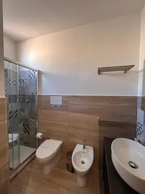 a bathroom with a sink and a toilet and a shower at A Casa di Josephine in Palermo