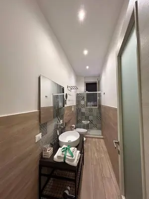 a bathroom with a sink and a mirror at A Casa di Josephine in Palermo