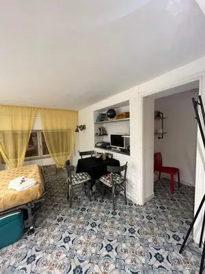 a bathroom with a shower and a toilet and a sink at Duba House Holiday Home in Palermo
