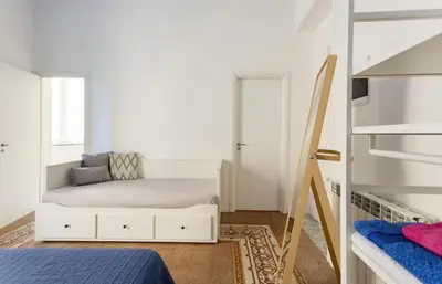 a bedroom with a bed and a bunk bed at Charmie flat in Palermo
