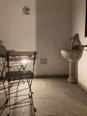 a bench and a sink in a room at Dost in Palermo