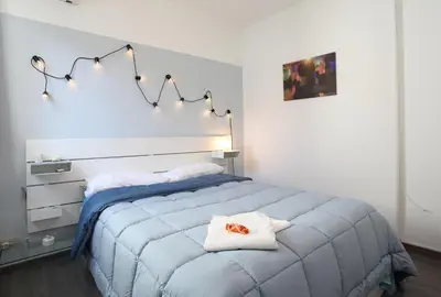 a bedroom with a bed with two towels on it at Alfredo Apartment a casa di alfredo in Palermo
